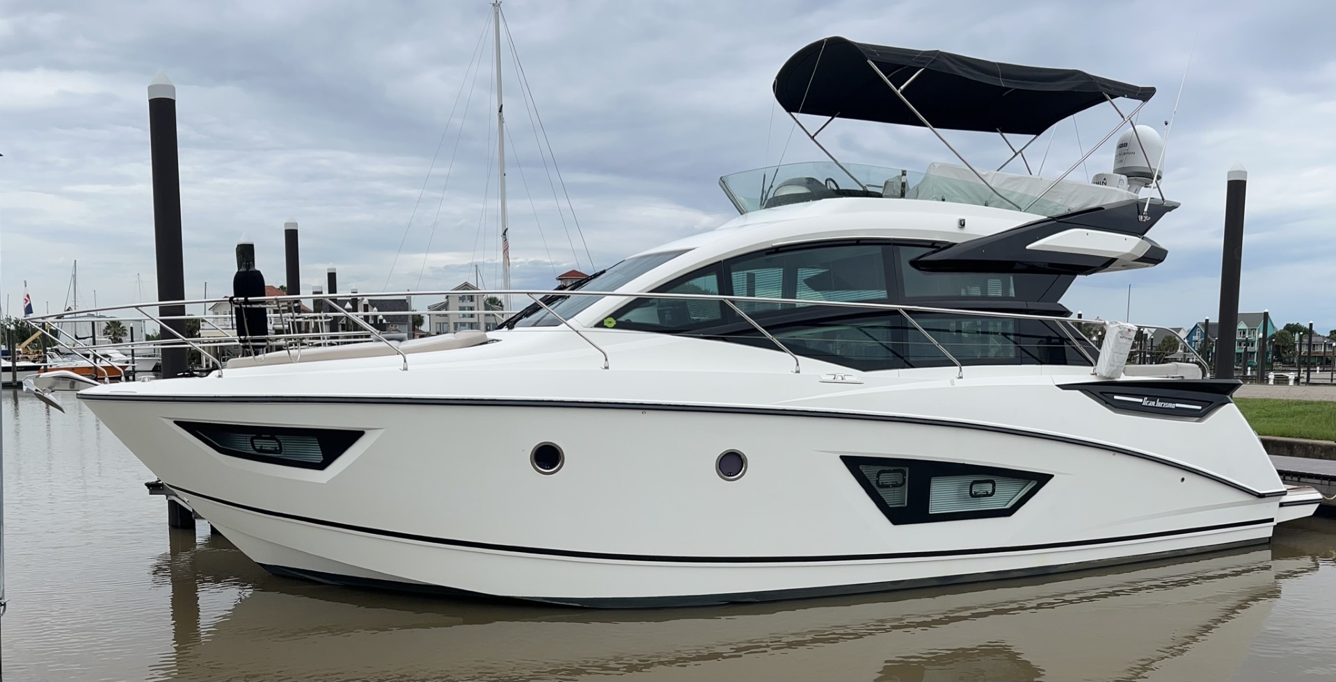 white motoryacht with fly-bridge